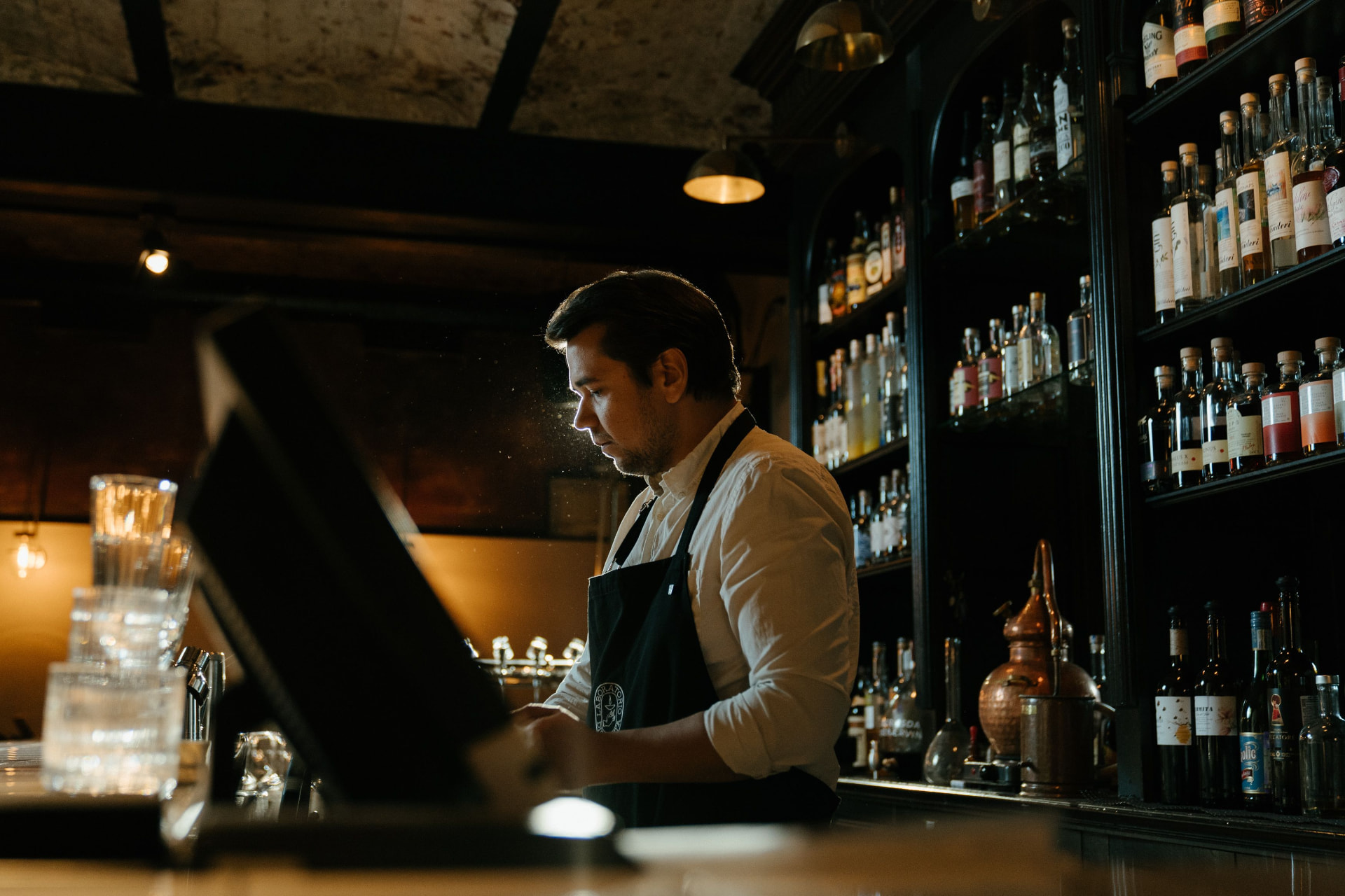 Hospitality team serving customers at a bar